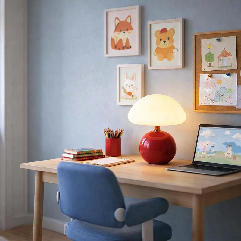 Nordic Ceramic Mushroom Table Lamp by Nordic Essentials on a desk in a child’s bedroom; red ceramic base, white shade.