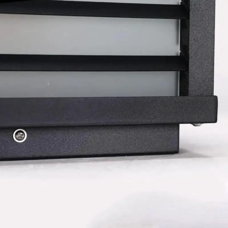 Close-up detail of weather-resistant aluminium frame on modern solar LED outdoor post light