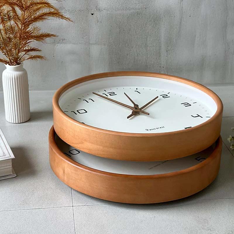 Nordic Wooden Wall Clock - Minimalist Silent Timepiece; wooden dual-ring clock with white dial on a living-room floor.