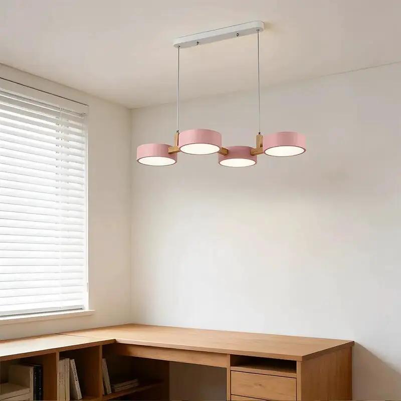Contemporary Scandinavian pendant light with pink circular LED shades and natural wood accents (10795371266381)